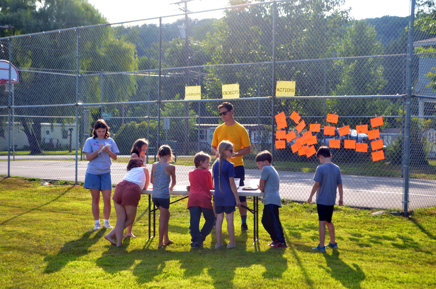 A group of ten-and-unders works with Alex Dearborn, a Narrowsburg resident and Homestead school teacher, to write down what they want to see in their town.